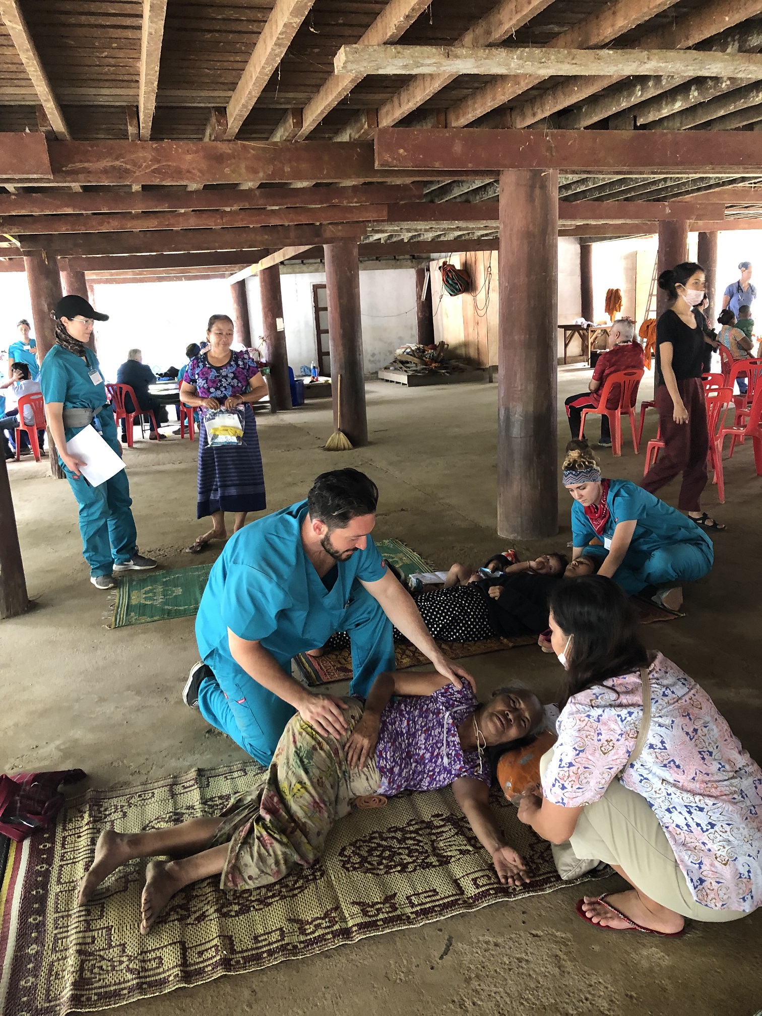 Student helping patient stretch